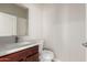 Clean half bathroom featuring a single sink, modern fixtures, and white toilet at 2000 N 36Th St # 14, Phoenix, AZ 85008