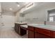 Bright bathroom with double sinks, white countertops, a large mirror and a bath tub at 2000 N 36Th St # 14, Phoenix, AZ 85008