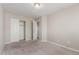 Carpeted bedroom with an open closet at 2000 N 36Th St # 14, Phoenix, AZ 85008