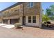 Stylish townhome featuring stone details, an attached single-car garage, and desert landscaping at 2000 N 36Th St # 14, Phoenix, AZ 85008