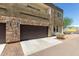 Contemporary townhome with a stone facade, a single-car garage, and low-maintenance landscaping at 2000 N 36Th St # 14, Phoenix, AZ 85008