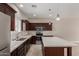 Modern kitchen with stainless steel appliances, granite countertops, and center island at 2000 N 36Th St # 14, Phoenix, AZ 85008