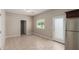 Clean and bright living area with access to a door, a window, and neutral walls at 2000 N 36Th St # 14, Phoenix, AZ 85008