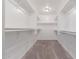Walk-in closet with carpet floors and shelving at 2000 N 36Th St # 14, Phoenix, AZ 85008