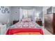 Bright bedroom with a large window, neutral walls, and a comfortable bed with unique, patterned bedding at 2020 W Union Hills Dr # 156, Phoenix, AZ 85027
