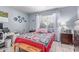 Well-lit bedroom featuring neutral-toned walls, a window, and cozy decor, complete with a desk space at 2020 W Union Hills Dr # 156, Phoenix, AZ 85027