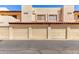 Exterior shot of garages showcasing the complex's secure parking options and traditional architecture at 2020 W Union Hills Dr # 156, Phoenix, AZ 85027