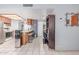 Open kitchen with barstool seating, stainless steel refrigerator, and adjacent dining area at 2020 W Union Hills Dr # 156, Phoenix, AZ 85027