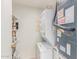 Practical laundry area equipped with a stacked washer and dryer, and shelving for storage solutions at 2020 W Union Hills Dr # 156, Phoenix, AZ 85027
