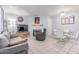 Bright living room with tile flooring, fireplace, sofa, and modern dining set at 2020 W Union Hills Dr # 156, Phoenix, AZ 85027