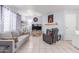 Comfortable living room featuring tile flooring, gray sofa, fireplace and tv at 2020 W Union Hills Dr # 156, Phoenix, AZ 85027