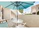Relaxing patio space with an umbrella, table, and chairs perfect for outdoor seating and dining at 2020 W Union Hills Dr # 156, Phoenix, AZ 85027
