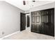 Bedroom featuring a closet and an open doorway at 2109 E Gelding Dr, Phoenix, AZ 85022