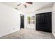 Bedroom with carpet flooring and a double-door closet at 2109 E Gelding Dr, Phoenix, AZ 85022