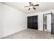 Neutral bedroom with closet and an entrance to the restroom at 2109 E Gelding Dr, Phoenix, AZ 85022