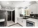Updated kitchen with white cabinets, modern countertops, stainless appliances, and stylish backsplash at 2109 E Gelding Dr, Phoenix, AZ 85022