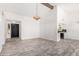 Expansive living space with wood-look flooring, recessed lighting, and seamless flow to the kitchen and entry at 2109 E Gelding Dr, Phoenix, AZ 85022