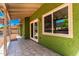 Covered patio featuring tiled floors, natural light, and access to the backyard at 2109 E Gelding Dr, Phoenix, AZ 85022