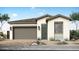 Charming single-story home with a two-car garage and neatly landscaped front yard at 2153 E Mill Rd, San Tan Valley, AZ 85140