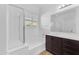 Bright bathroom showing a shower, bathtub, and double-sink vanity for a complete and functional space at 2459 E Lindrick Dr, Gilbert, AZ 85298