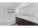 Well-lit bathroom features a bathtub and double sinks, promoting a spa-like experience at 2459 E Lindrick Dr, Gilbert, AZ 85298