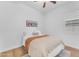 Cozy bedroom with a ceiling fan and neutral decor, creating a comfortable and inviting atmosphere at 2459 E Lindrick Dr, Gilbert, AZ 85298