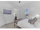 Cozy bedroom with soft lighting, a comfortable bed, and plantation shutters offering plenty of natural light at 2459 E Lindrick Dr, Gilbert, AZ 85298
