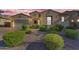 Charming single-story home featuring manicured landscaping and a welcoming entrance in a desirable neighborhood at 2459 E Lindrick Dr, Gilbert, AZ 85298