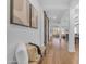Inviting hallway with hardwood floors, sliding barn doors, and a seamless flow into the living spaces at 2459 E Lindrick Dr, Gilbert, AZ 85298