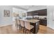 Stylish kitchen features dark wood cabinets, granite countertops, and stainless steel appliances at 2459 E Lindrick Dr, Gilbert, AZ 85298