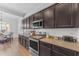 Updated kitchen with granite counters, stainless appliances, and convenient access to the dining area at 2459 E Lindrick Dr, Gilbert, AZ 85298
