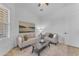 Bright living room with neutral tones, comfortable seating, and a stylish coffee table on an area rug at 2459 E Lindrick Dr, Gilbert, AZ 85298