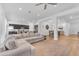 Open-concept living space with neutral furnishings seamlessly connects the kitchen and dining areas at 2459 E Lindrick Dr, Gilbert, AZ 85298