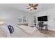Spacious main bedroom with wood floors, a ceiling fan, and outdoor access at 2459 E Lindrick Dr, Gilbert, AZ 85298