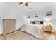Inviting main bedroom featuring wood furniture, soft lighting, and neutral tones at 2459 E Lindrick Dr, Gilbert, AZ 85298