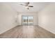 Spacious bedroom with ceiling fan and sliding glass doors to the backyard at 25960 W Tonto Ln, Buckeye, AZ 85396