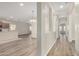 Open concept hallway showcasing views of the living and dining areas at 25960 W Tonto Ln, Buckeye, AZ 85396