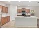 Modern kitchen featuring an island with sink, and plenty of cabinet storage at 25960 W Tonto Ln, Buckeye, AZ 85396