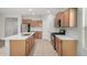Updated kitchen with stainless appliances, gas range, and large island with breakfast bar at 25960 W Tonto Ln, Buckeye, AZ 85396