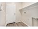 Laundry room with shelving and exterior access door at 25960 W Tonto Ln, Buckeye, AZ 85396