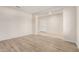 Bright living room with neutral paint, plank flooring, and ample natural light at 25960 W Tonto Ln, Buckeye, AZ 85396