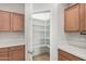 Spacious pantry in the kitchen with ample shelving for organized storage at 25960 W Tonto Ln, Buckeye, AZ 85396