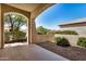 Covered patio offers a private outdoor space with views of the landscaped backyard at 25960 W Tonto Ln, Buckeye, AZ 85396