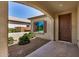 Inviting covered porch with charming desert landscaping and a front entrance at 25960 W Tonto Ln, Buckeye, AZ 85396