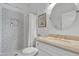 Nicely decorated bathroom featuring a patterned shower, neutral vanity, decorative mirror and wall art at 2911 E Leland St, Mesa, AZ 85213