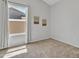 Bedroom with gray walls, carpet, and a window dressed with flowing curtains at 2911 E Leland St, Mesa, AZ 85213