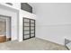 Light filled bedroom with carpet, white walls, and closet featuring sliding doors at 2911 E Leland St, Mesa, AZ 85213