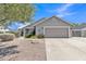 Charming single-story home featuring a two-car garage, desert landscaping, and lovely curb appeal at 2911 E Leland St, Mesa, AZ 85213