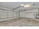 Spacious two-car garage with concrete floor, overhead lighting, and a water heater at 2911 E Leland St, Mesa, AZ 85213