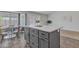 Kitchen island with marble countertop, seating, and access to an adjacent dining area at 2911 E Leland St, Mesa, AZ 85213